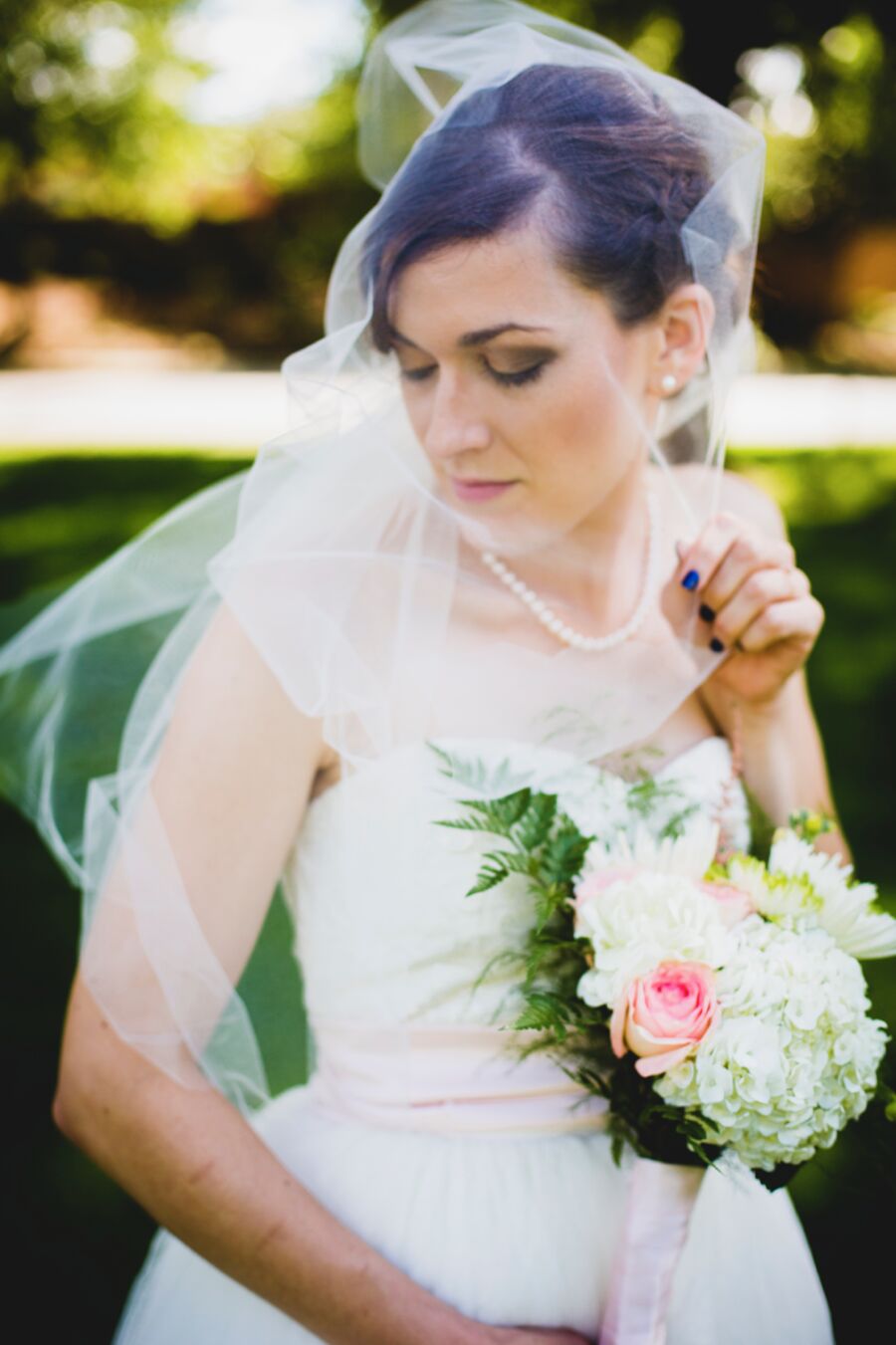 Bride in veil with bouquet